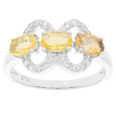 Oval yellow sapphire and citrine sterling silver ring with sparkling accents, showcasing elegant design and luxury.